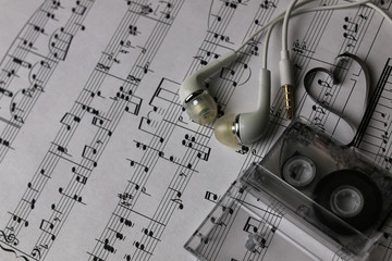 notes background and headphones