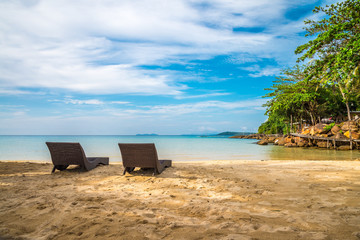 Daybed on beautiful tropical island beach in sunny day blue sky background. Summer tropical travel holiday vacation or green nature concept.