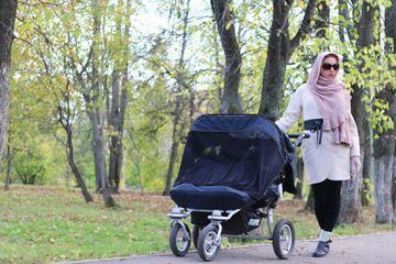 girl in the park with stroller
