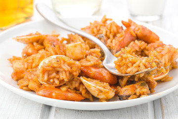 making close to rice dish with seafood