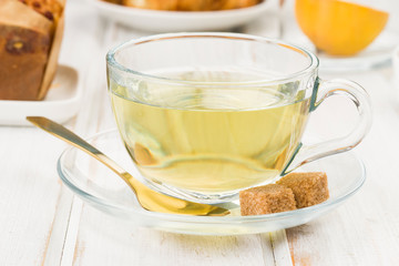 cup of green tea on wood