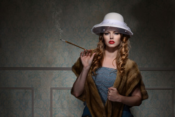 1940s woman wearing hat and smoking