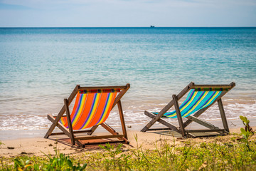 Colorful beach chair on beautiful tropical island beach summer holiday - Travel vacation concept.