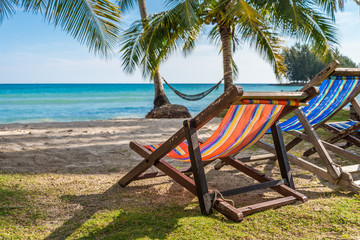 Obraz na płótnie Canvas Colorful daybed in beautiful tropical island beach - Travel summer holiday concept