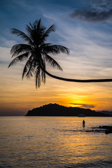 Fototapeta na wymiar Beautiful tropical island beach in sunset evening - Travel summer holiday concept.