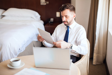 Businessman doing some work at a hotel