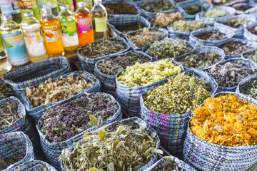 Dried herbs flowers spices in the spice souq at local market in