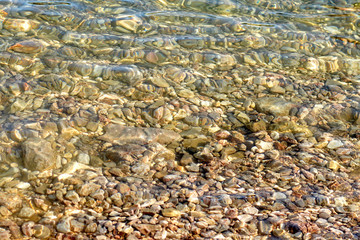 Pebble stones under sea water