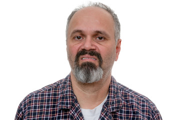 Disgusted man with beard makes face at camera