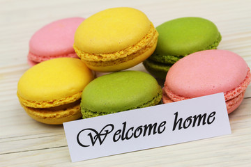Welcome home card with colorful sweet macaroons
