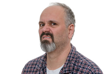 Angry balding man with beard sneers at the camera
