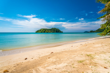 Beautiful tropical island beach in sunny day blue sky background. Summer tropical travel holiday vacation or green nature concept.