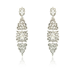 Pair of silver diamond earrings isolated on white