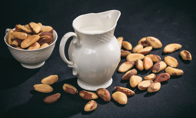 Vegan milk from brazil nuts on black background