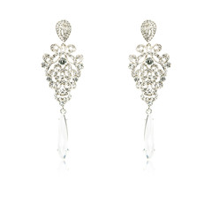 Pair of silver diamond earrings isolated on white