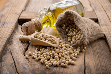 closeup is some soybeans with wooden spoon