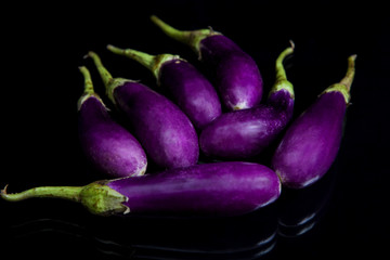Heap of fresh eggplants close up
