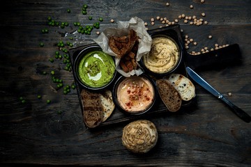 hummus in a bowl on a wooden table

