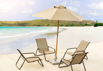 Chairs and umbrella on a beautiful tropical beach