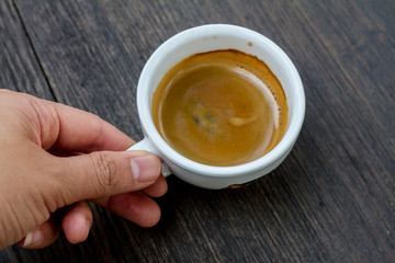 Espresso double shot on wood background vintage tone