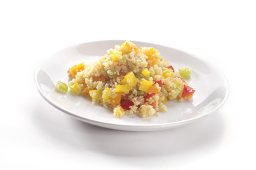 Close up of colored quinoa salad with vegetables