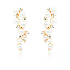Pair of diamond and natural pearls earrings isolated on white
