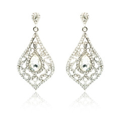 Pair of silver diamond earrings isolated on white