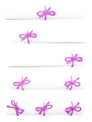 White paper rolls tied with pink cords and nodes collection
