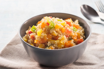 Close up of quinoa salad on blue old wooden table