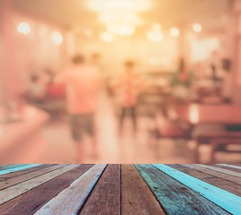 wood table and blur people at buffet catering room.