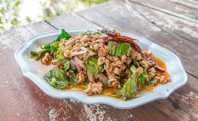 Larb chicken salad. Traditional Thai food, with ground chicken lime, chili and herbs. This food is popular in the north-east of the country (Isaan)