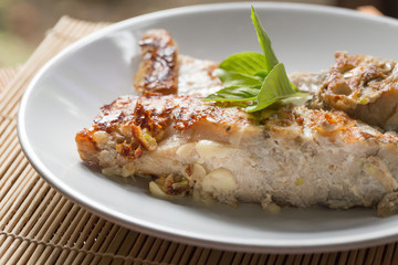A fried fish on plate.