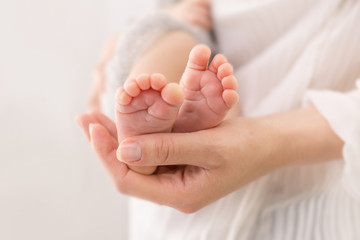 baby feet in mother hands 