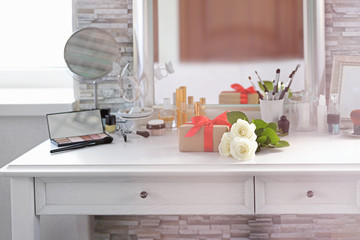 Present with cosmetic set on light dressing table