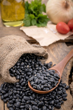 Black beans in a wooden