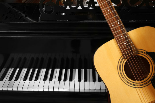 Guitar with piano, close up