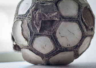 Very old cracked ball for soccer or football