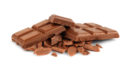 Pile of milk chocolate tiles isolated on white