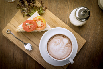 Coffee cup and sandwiches