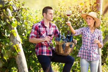 Proudly couple enjoying in wine