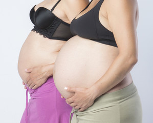 Pregnant Women holding her hands on beautiful belly