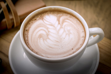 Coffee cup and notebook