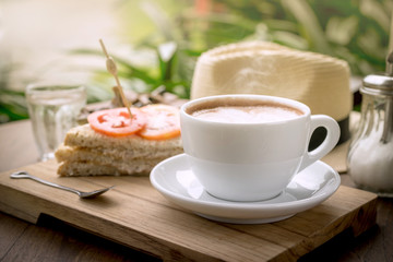 Coffee cup and sandwiches