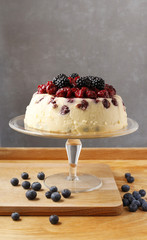Cheesecake with cherries, blackberries and blueberries.
