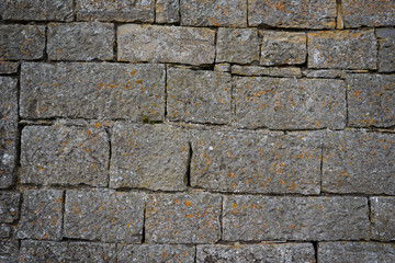 Unshaped stone wall pattern,wall made of rocks with round vignet