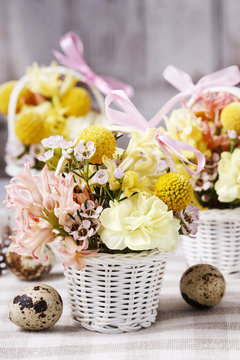 Wicker baskets with early spring flowers