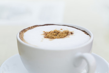 A  hot coffee in cup.