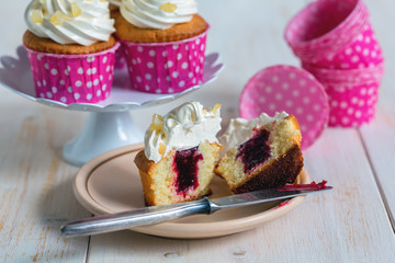 Lemon cupcakes with fruit filling.