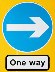 Illuminated One Way Sign with Blue Arrow pointing to the right