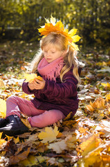 happy girl in autumn leaves